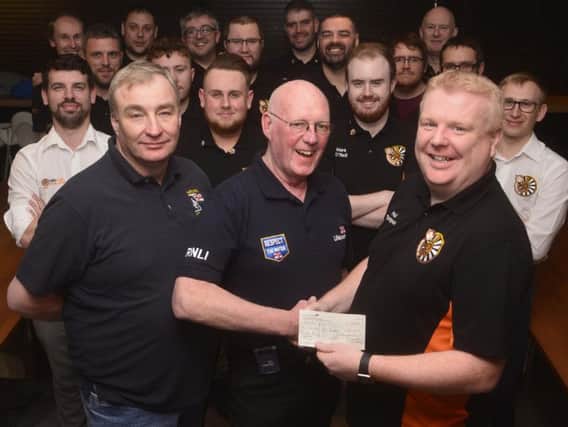 Round Table chairman Paul Thompson(right) and fellow members present the cheque to Ray Walker and Mark Barker of the Hartlepool RNLI. Picture: RNLI/Tom Collins.