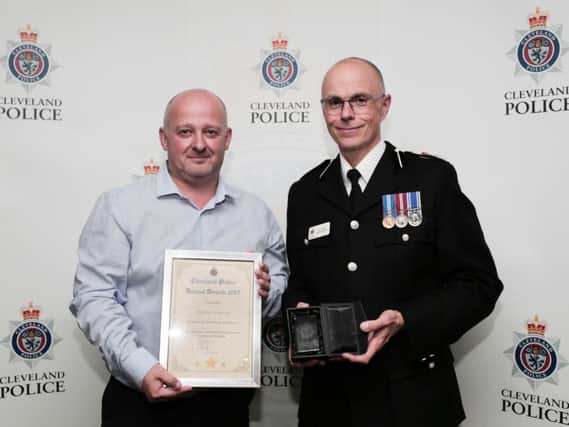 Pc Mick Johnson and then then Chief Constable Iain Spittle.