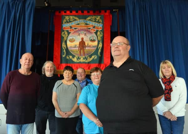 Horden Banner Committee has unveiled the villages new banner. Front is chairman Robert Dowson with committee members.