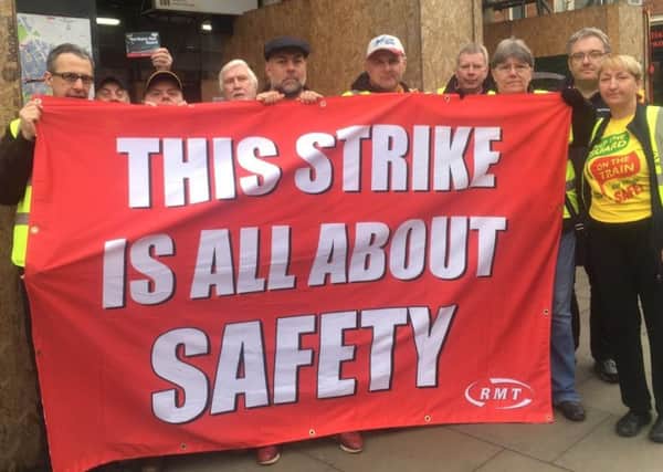 RMT members stage a protest.