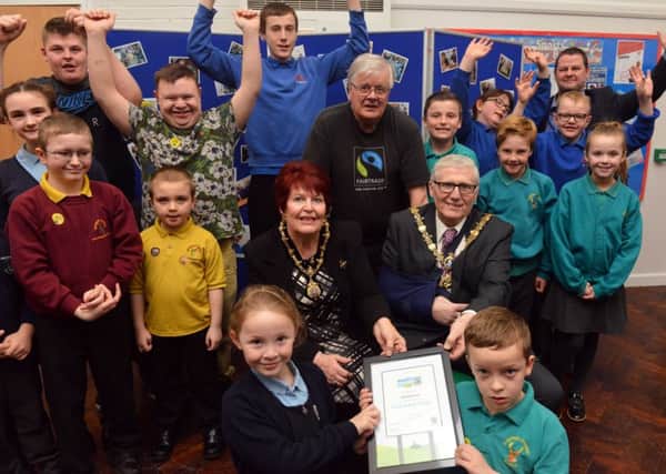 Fairtrade supporters from Catcote Academy at a previous coffee morning event with Martin Green of Hartlepool Fairtrade Steering Group (centre) and Hartlepool Deputy Mayor Rob Cook with wife Brenda.