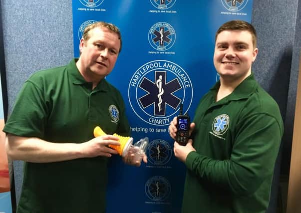 Hartlepool Ambulance Charity members Jason Anderson (left) holding a vac-mask for choking, and trustee Dan Hewitson with one of their radios.