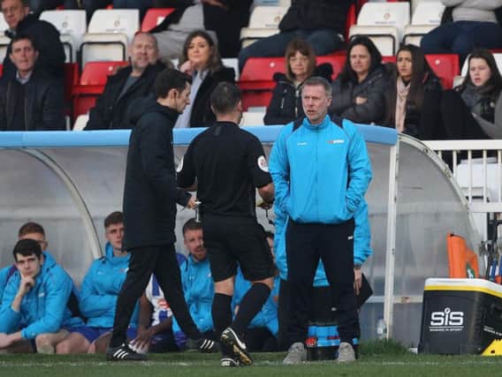 Hartlepool boss Craig Hignett was shown a yellow card by the referee midway through the first half.