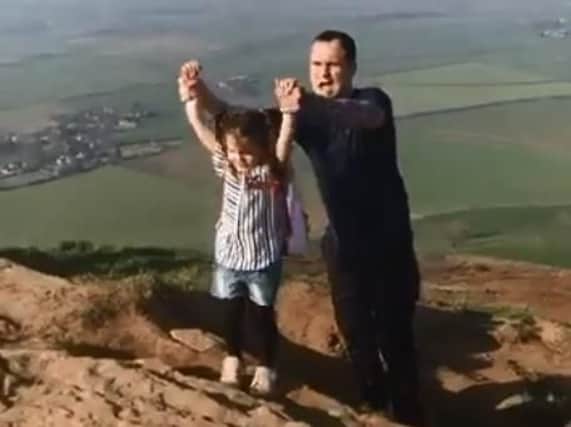 Lyla O'Donovan and dad Paul as they reach the top of Roseberry Topping.