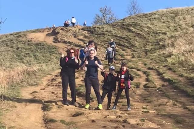 Lyla with her dad and other participants during the Roseberry Topping climb.