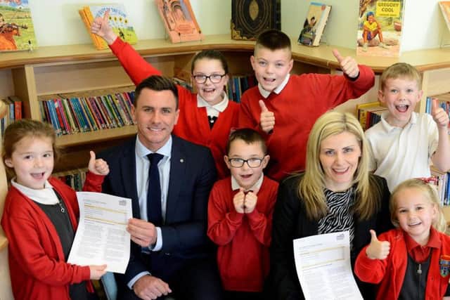 St Helen's primary school Headteacher Carole Bradley and Deputy Headteacher Marcus Newing celebrate their Ofsted report with pupils Ella Sanderson, Jack Wilmot, Macauley Myers, Cole Rayner, Tia Wormald and Mia Pearce.