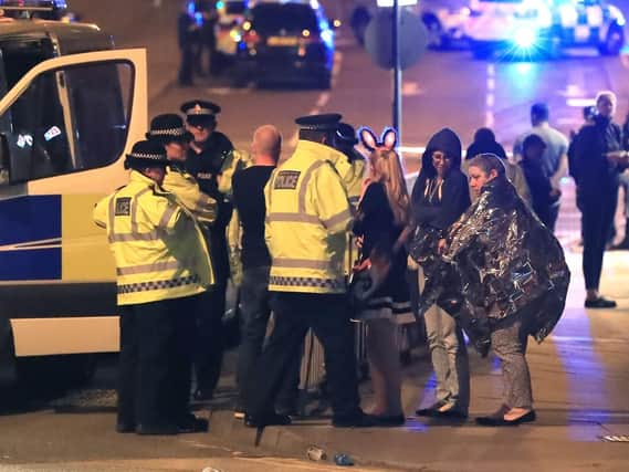 Emergency services at the scene of the attacks. Picture: PA.