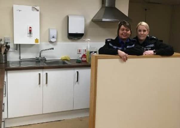 Members of Peterlee Neighbourhood Policing Team check out progress as the new kitchen is fitting in their police station.
