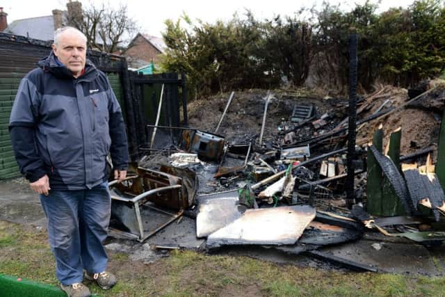 Eldon Grove Bowling and Tennis Club Chairman Tony Evans overlooks the remains of a storage shed that was destroyed in a fire. Picture by FRANK REID