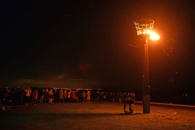 Crowds begin to disperse at the end of the Headland beacon lighting ceremony. Picture by BERNADETTE MALCOLMSON