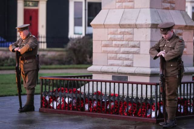 The annual Bombardment Remembrance Ceremony at Hartlepool Headland.   The Durham Pals stand by the memorial.  Picture: TOM BANKS