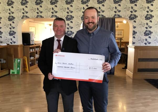 Hartlepool Golf Club 2018-19 captain Neil Ashby (left) hands over a cheque for £17,000 to Greg Hildreth of Alice House Hospice.