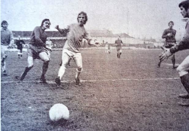 Ken Ellis goes on the attack at a Victoria Ground match watched by more than 6,000 fans.