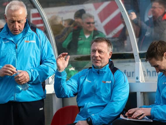 Ged McNamee (left) with manager Craig Hignett and coach Antony Sweeney (right).