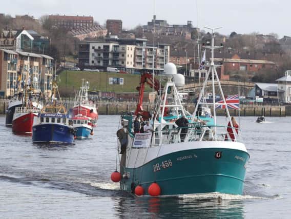 A flotilla of fishing boats on the Tyne in a protest, organised by Campaign for an Independent Britain and Fishing for Leave last April. Photo by PA.