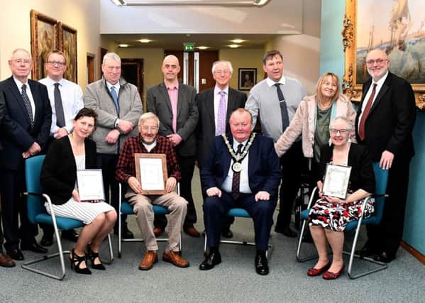 The Mayor of Hartlepool Councillor Alan Barclay with (sitting left to right) Lisa Barwick, Drew Mills and Karen Milner after he presented them with their certificates, with invited guests standing.