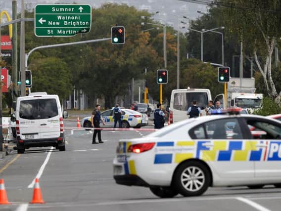 Police block the road near the shooting at a mosque in Linwood, Christchurch, New Zealand, Friday, March 15, 2019. Multiple people were killed during shootings at two mosques full of people attending Friday prayers. (AP Photo/Mark Baker).