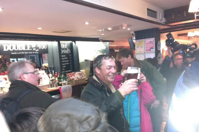 Nigel Farage toasts the first day of the protest at the Merry Go Round pub.