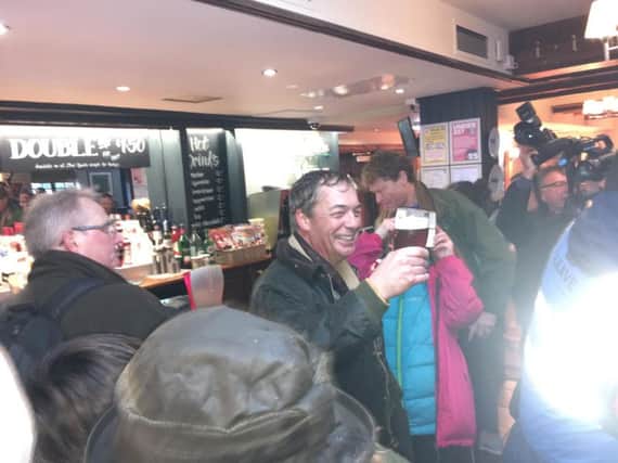 Nigel Farage toasts the first day of the protest at the Merry Go Round pub.