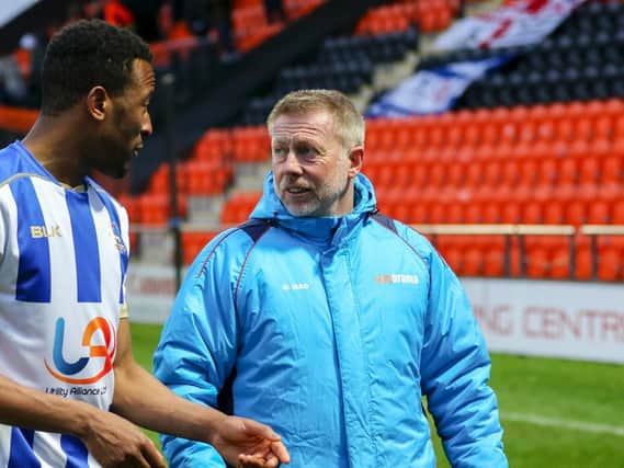 Nicke Kabamba with manager Craig Hignett at The Hive on Saturday.