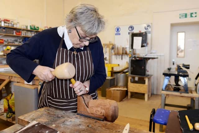 Jennifer Turner working on a carving at the Men's Shed Osborne Road. Picture by Frank Reid.