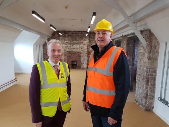 Hartlepool Borough Council leader Councillor Christopher Akers-Belcher (left) and Councillor Kevin Cranney, chair of the councils Regeneration Services Committee, inspect progress in one of the BIS units.
