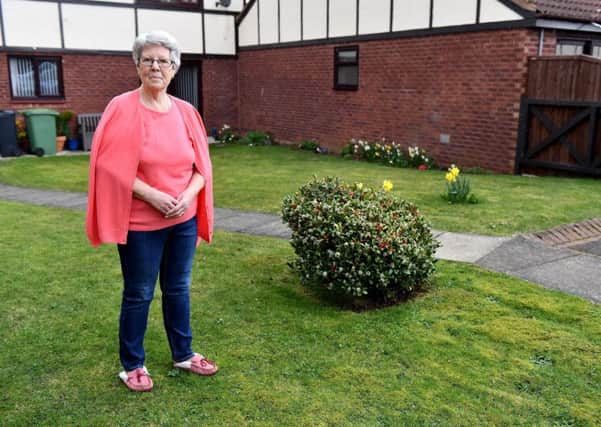Patricia Brown from The Sycamores next to the spot where her washing pole was removed by the residents association. Picture by FRANK REID