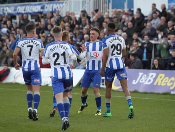 Hartlepool United's players celebrate after Josh Hawkes nets from the spot (Shutterpress).