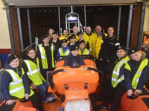 Junior members of Hartlepool sea cadets pictured with Hartlepool RNLI crewmembers during their visit to the Ferry Road lifeboat station. Picture: RNLI/Tom Collins