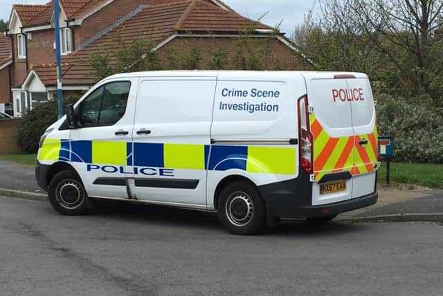 A police van at the scene on Monday