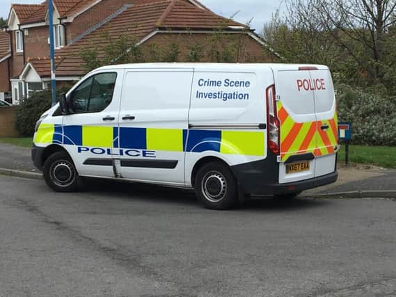 A police van at the scene on Monday