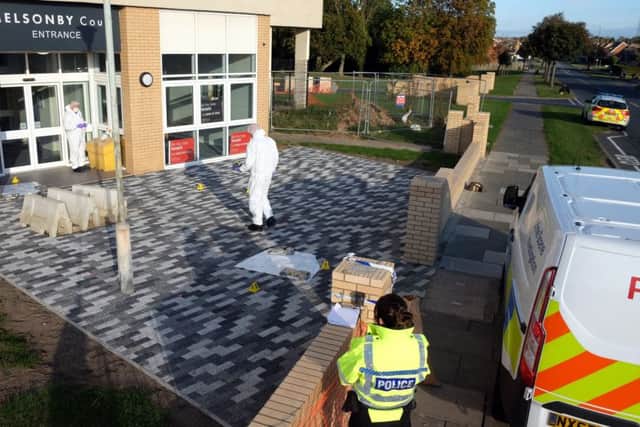 Police and Crime Scene Investigators are at the scene outside Melsonby Court in Billingham where Peter Gilling was stabbed.