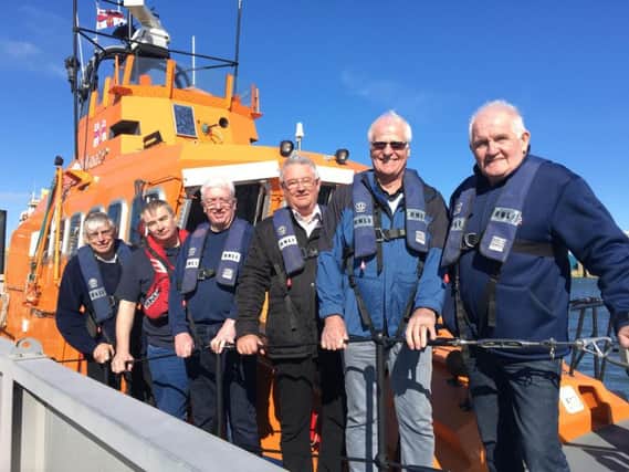 Pictured on the all weather lifeboat are(left to right) Hartlepool RNLI chairman Malcolm Cook, crewmember Mark Barker, John Denholm and Ken Auton of the Hartlepool Clubs Consultative Committee, Frank Olley of Teesside Beer and Hartlepool RNLI fundraising co-ordinator Tommy Price. Picture: Tom Collins/RNLI.