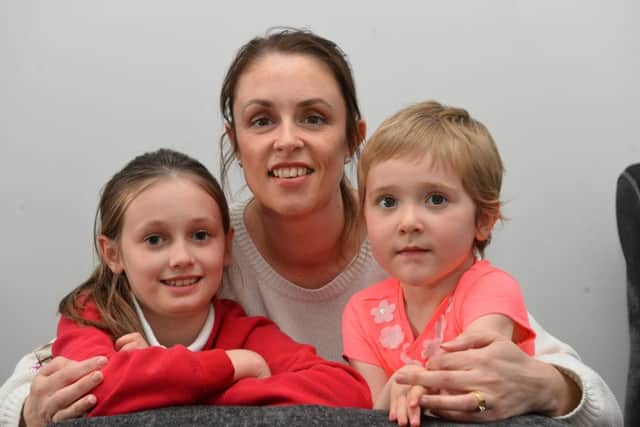 Daisy Sayers, three, with mother Melissa Sayers and sister Poppy, eight.
