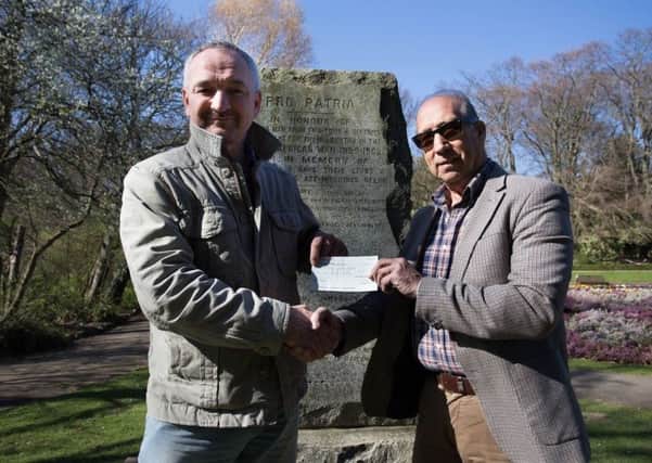 Stephen Close (left) of History  of Hartlepool group with Tony Kaid of Cafe Rapport in front of the Boer War plinth in Ward Jackson Park.