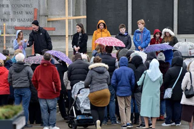 Around 100 people attend the open air service whatever the weather.