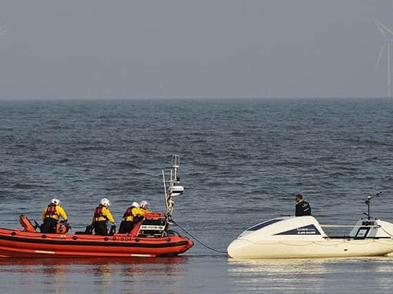 Hartlepool RNLI inshore lifeboat and volunteer crew pictured with the rowing boat. Photo by RNLI/Tom Collins.