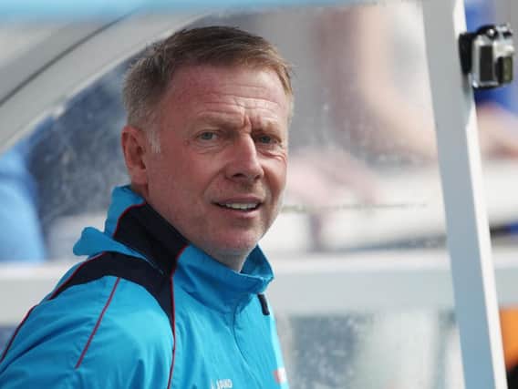 Hartlepool United, managed by Craig Hignett (above) travel to Holker Street to take on AFC Barrow today.