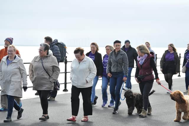 Walkers strolled along the Headland promenade.