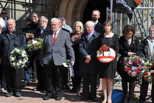 Guests at the Workers Memorial Day service in Hartlepool gather to lay wreaths.