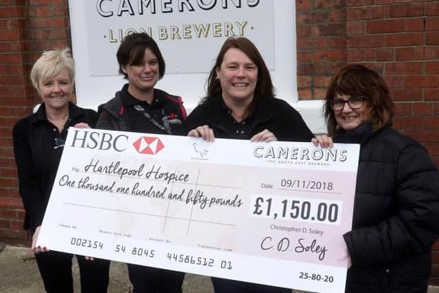 Janice Hobs from the Alice House Hospice receiving their cheque from Fiona Dineen, Gemma Tucker and Karen Cutler from Camerons Brewery.