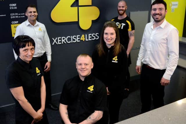 Adam Sowerby (sitting) with rear left to right) Chris Richardson and Scott Reeves front (left to right) Hannah Foley, Christine Whiley and John Wright at Xercise4less. Picture by FRANK REID