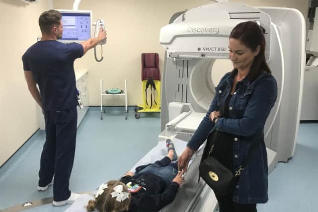 Millie Crone was the first patient to use the new GE Discovery 850 SPECT-CT scanner.
