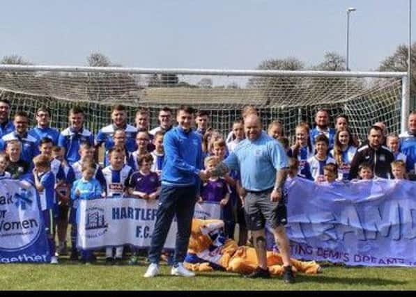 FC Hartlepool teams show their support for Miles For Men. Centre is first team captain Jack Swales and Miles For Men founder Micky Day.
