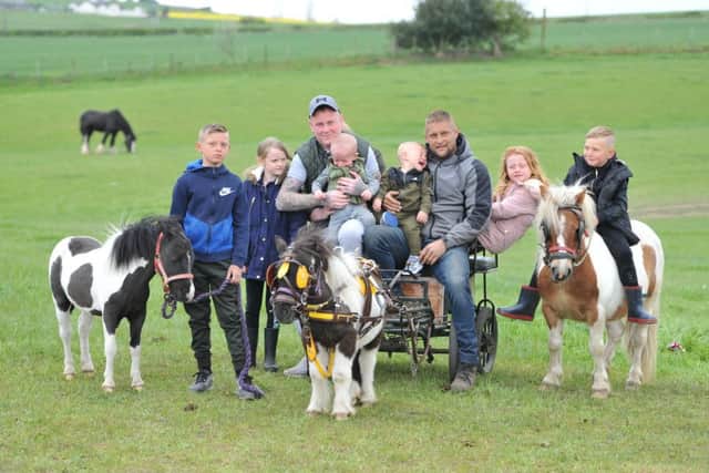 Teddie McCallum, pictured with parents David and Sarah, have been supported by the horse and travelling community as they raise funds for the NECCR team.