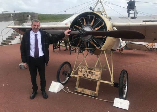 Mike Hill with a First World War bi-plane at the Heugh Battery in Hartlepool.