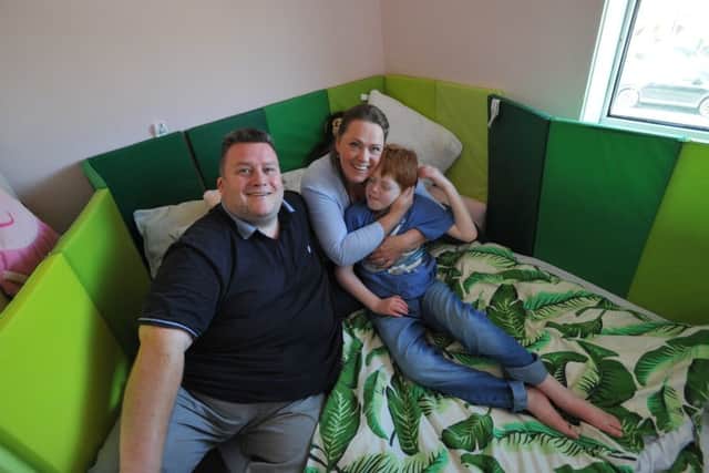 Victoria Edmundson-Brown and Peter Kelly with son Benjamin in his old bedroom in their Easington Colliery home.