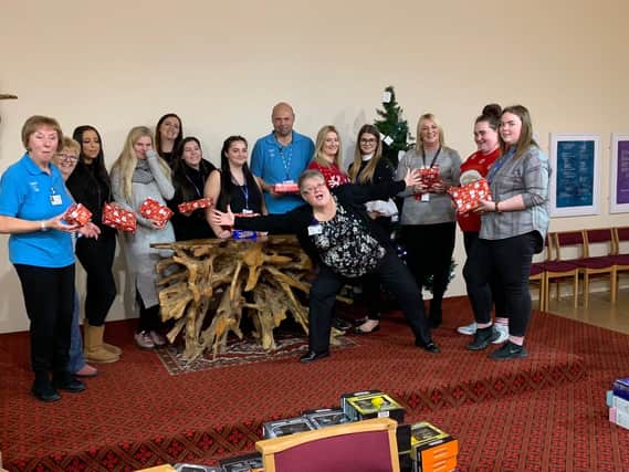 Students from Hartlepool College of Further Education help hospital patients.