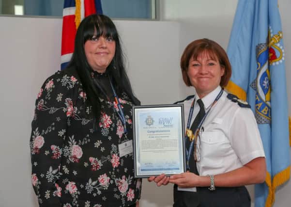 Pc Andrea Wearmouth is presented with her award by Durham Constabulary's Deputy Chief Constable Jo Farrell.