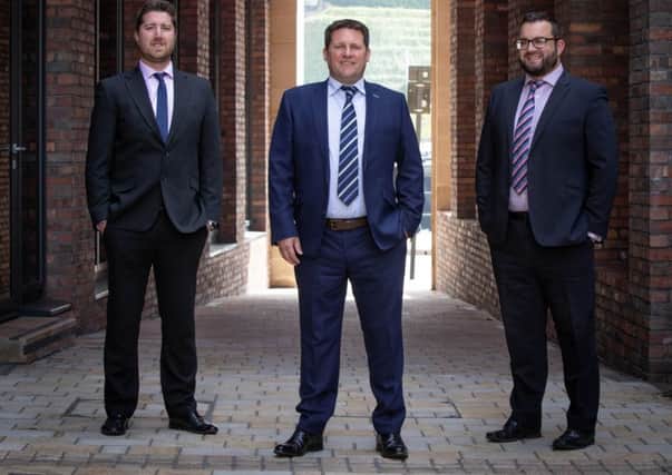(from left) Stephen Litherland with Hedley Planning Services Sean Hedley and Joe Ridgeon